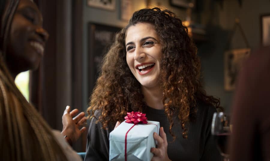 close-up-smiley-woman-receiving-gift